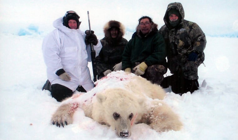 Hunter Jim Martell, left, and others pose with the bear he shot on Banks Island in Canada's Northwest Territory. DNA tests later showed the bear had a polar bear for a mother and a grizzly bear for a father. 